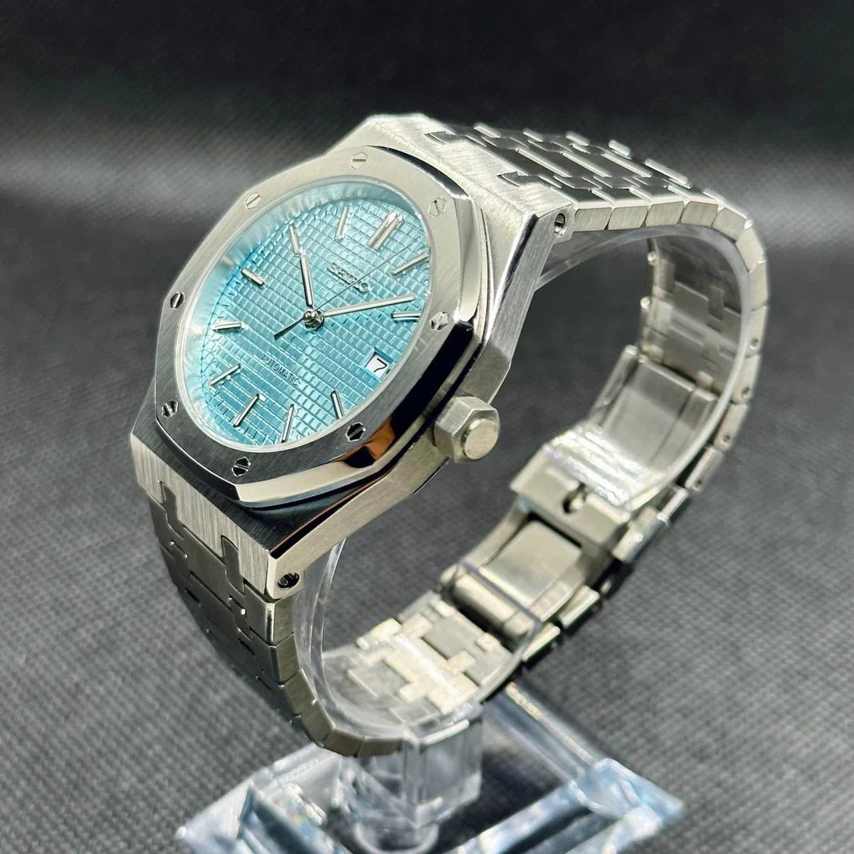 Montre automatique ModTime de style Royal Oak — configuration bleu clair (NH35), cadran bleu clair, couronne, vue en biais côté droit
