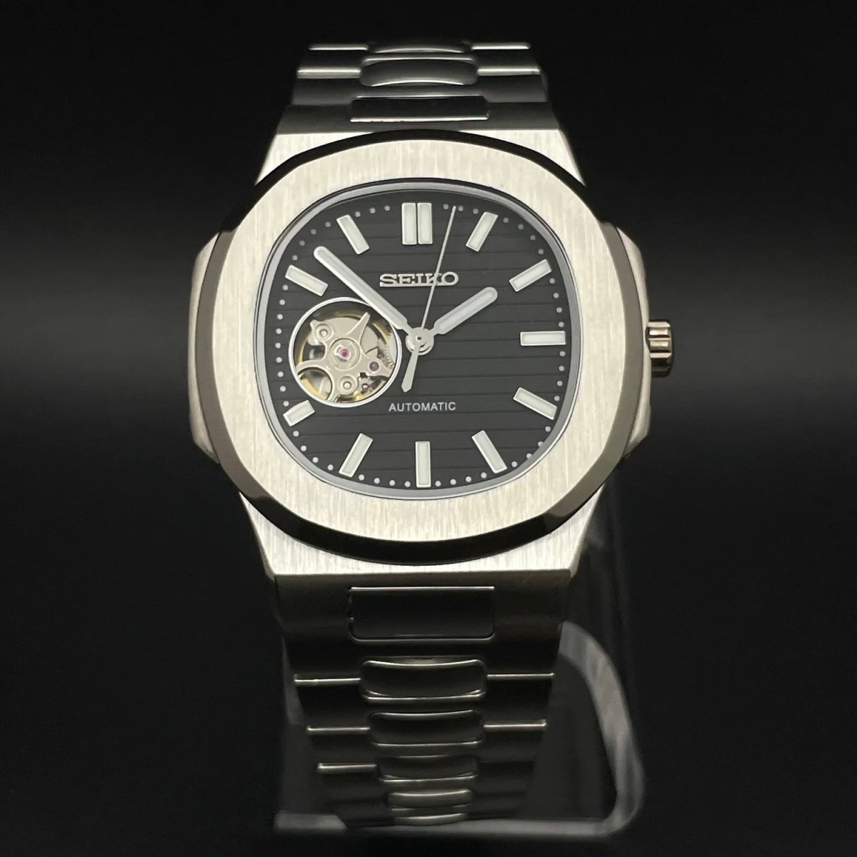 Nautilus Mod Silver Black Open Heart Dial silver and black Seiko mod style watch with NH38 open-heart movement by ModTime - angled dial view