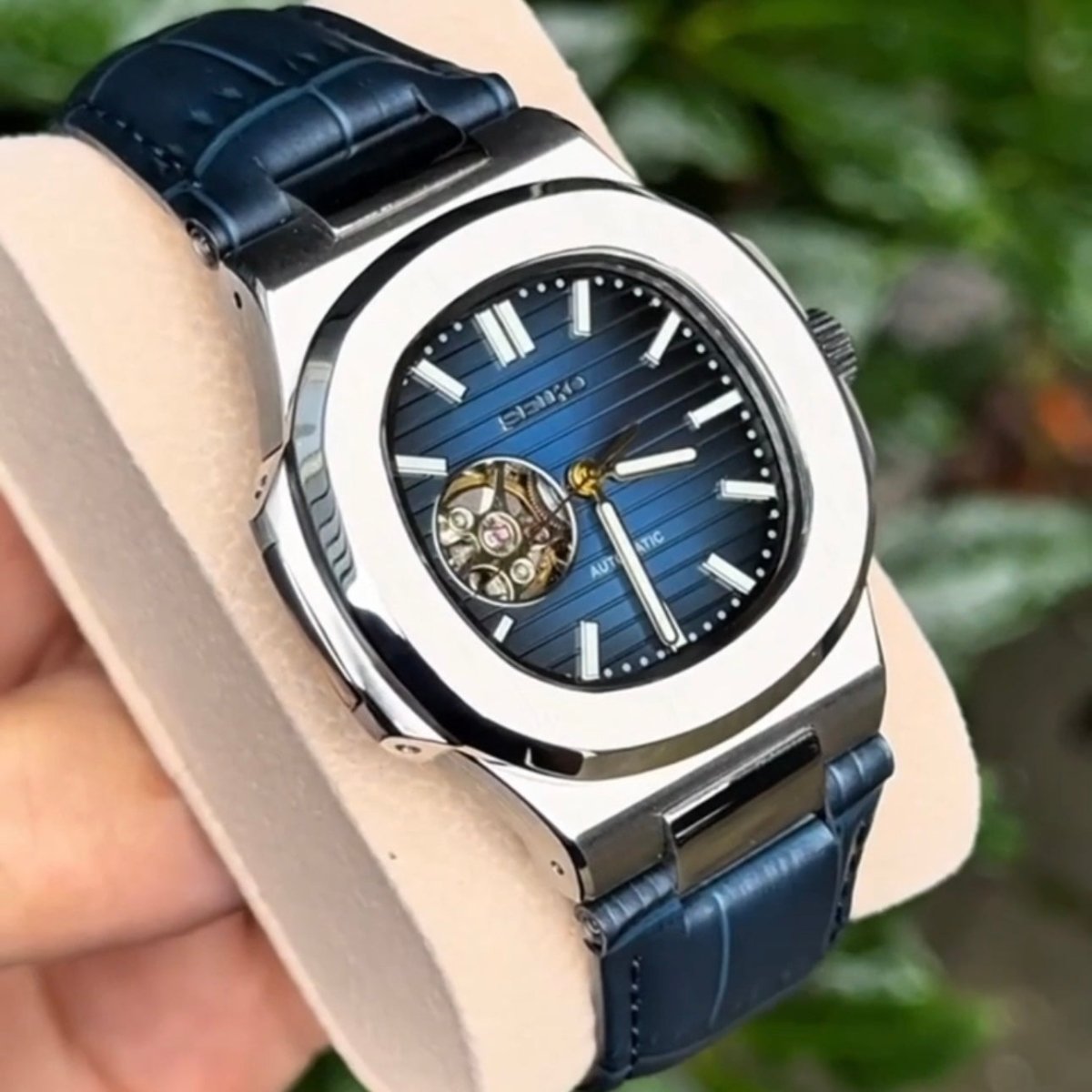 ModTime silver and blue Nautilus Mod Silver Blue Open Heart Dial Leather Strap watch travel accessory for custom watches - case and bracelet detail