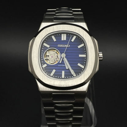 Nautilus Mod Silver Blue Open Heart Dial silver and blue Seiko mod style watch with NH38 open-heart movement by ModTime - angled dial view