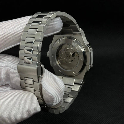 ModTime Nautilus-style Silver Skeleton listing (NH38): silver-tone caseback, rotor marked NH35A, gloved rear view