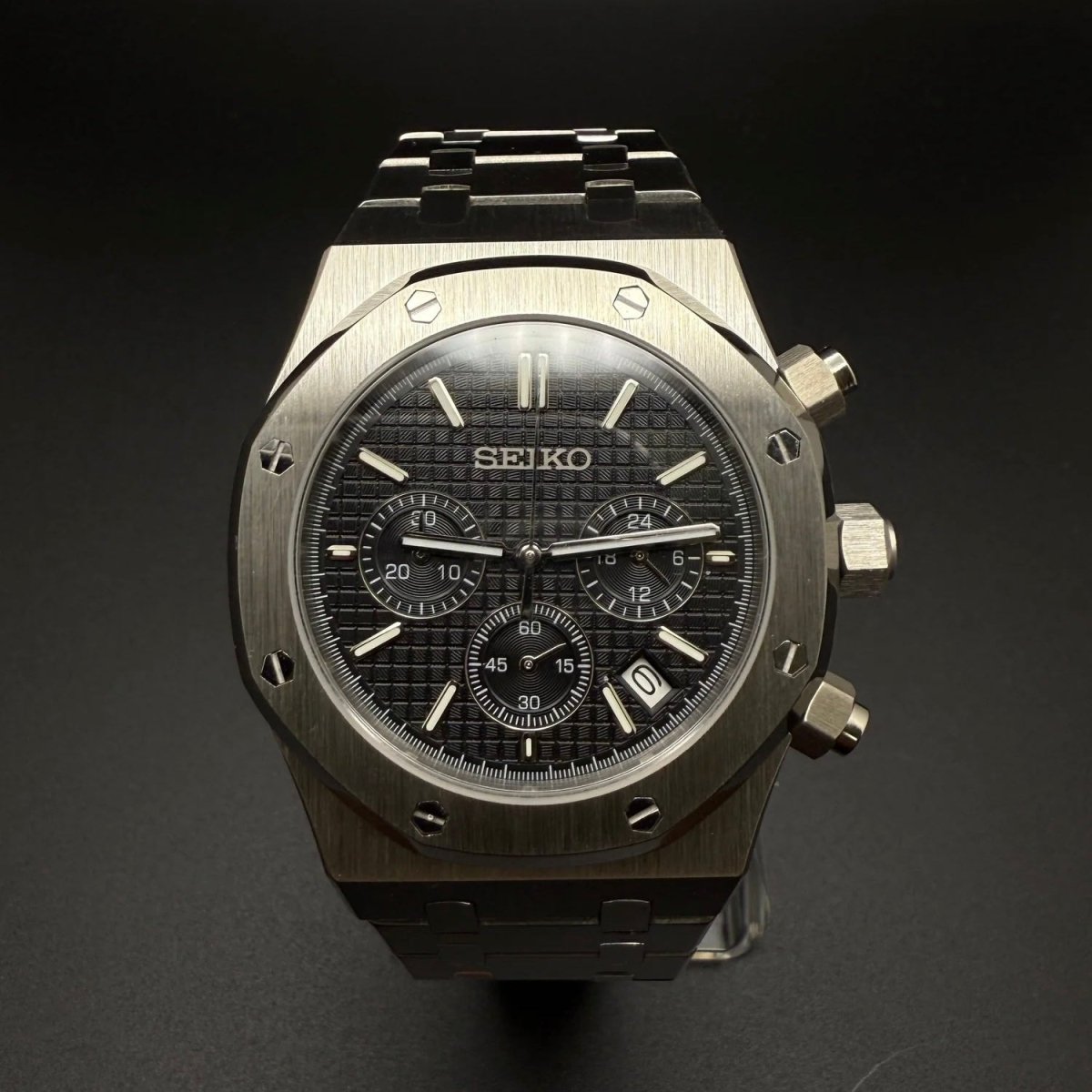 Seiko Mod Royal Oak Style Black Dial Chronograph black integrated bracelet Seiko mod style watch with VK63 movement by ModTime - angled dial view