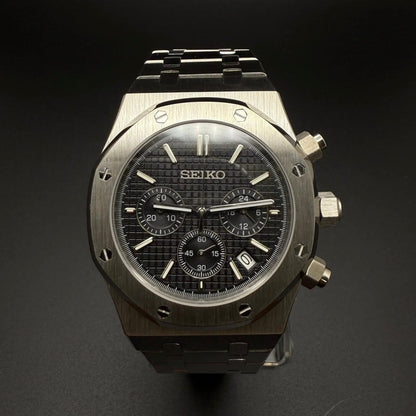 Seiko Mod Royal Oak Style Black Dial Chronograph black integrated bracelet Seiko mod style watch with VK63 movement by ModTime - angled dial view