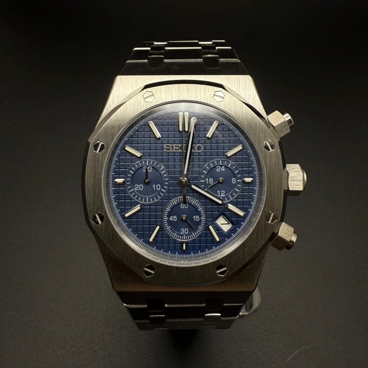 Seiko Mod Royal Oak Style Blue Dial Chronograph blue integrated bracelet Seiko mod style watch with VK63 movement by ModTime - angled dial view