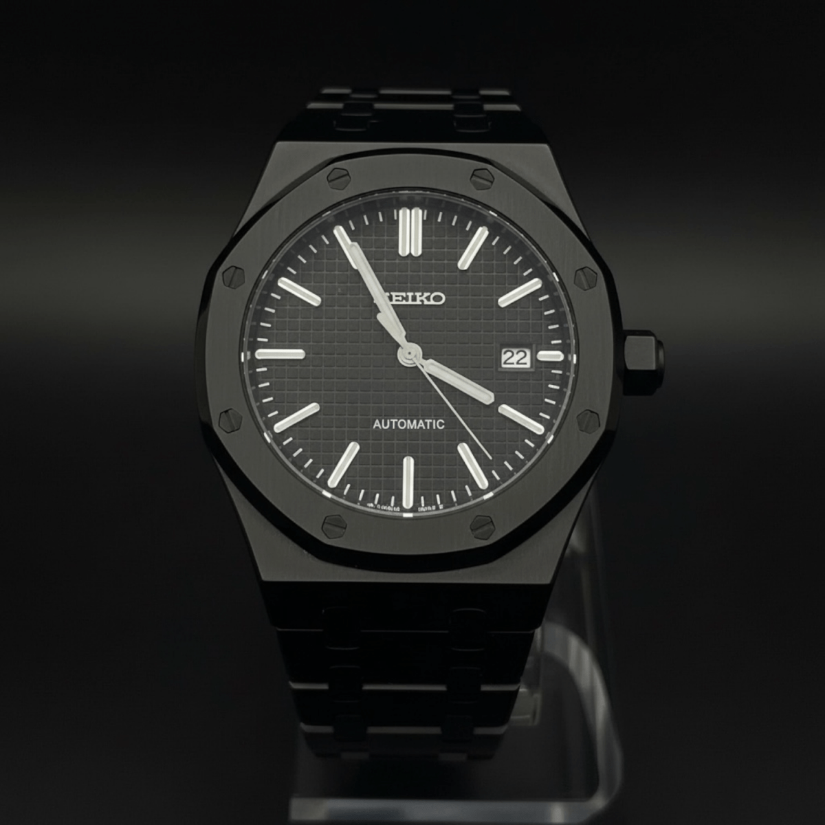 Seiko Mod Royal Oak Style All Black Dial black integrated bracelet Seiko mod style watch with NH35 automatic movement by ModTime - angled dial view