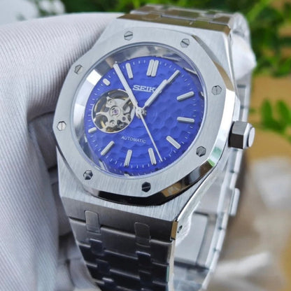 Royal Oak Mod Silver Blue Open Heart silver and blue Seiko mod style watch with NH38 open-heart movement by ModTime - angled dial view